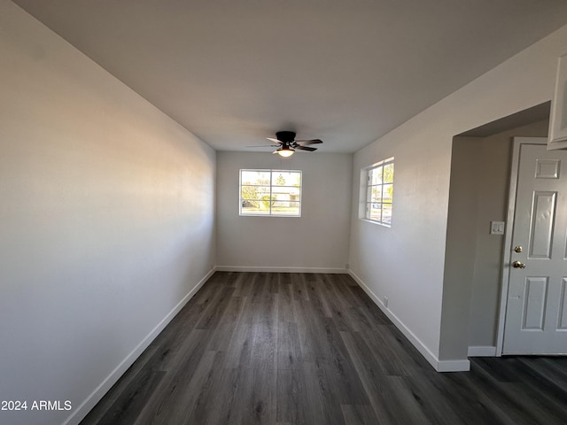 unfurnished room featuring dark hardwood / wood-style floors and ceiling fan