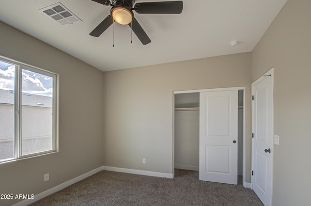 unfurnished bedroom featuring carpet flooring, ceiling fan, and a closet