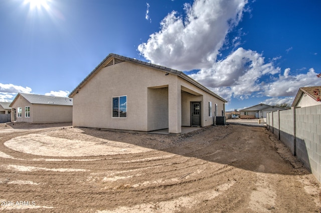 rear view of property with central air condition unit