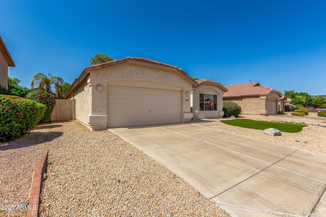 6502 W Wahalla Ln, Glendale, AZ 85308 - view of front facade featuring a garage, stucco siding, and driveway