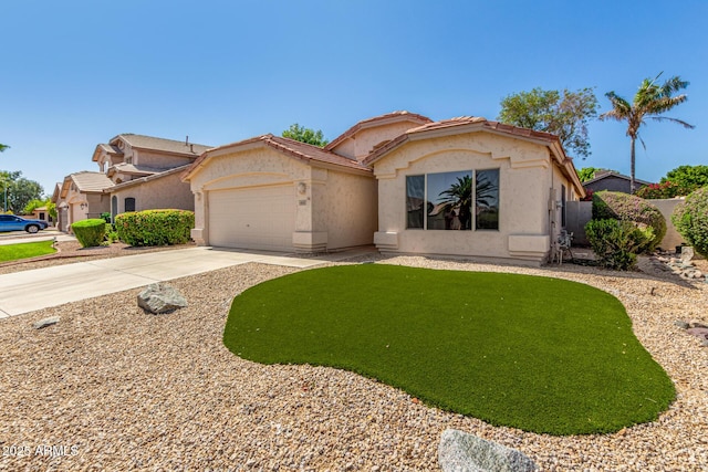 6502 W Wahalla Ln, Glendale, AZ 85308 - view of front of home with stucco siding, a garage, and driveway