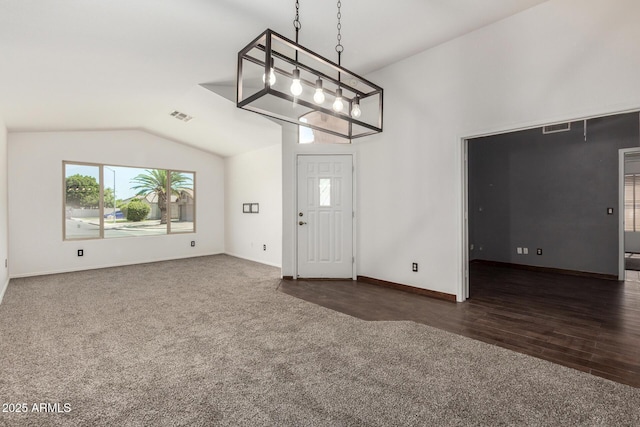 6502 W Wahalla Ln, Glendale, AZ 85308 - entrance foyer with dark carpet, vaulted ceiling, a chandelier, and dark wood finished floors