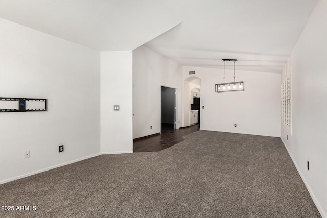 6502 W Wahalla Ln, Glendale, AZ 85308 - unfurnished room featuring dark colored carpet and arched walkways