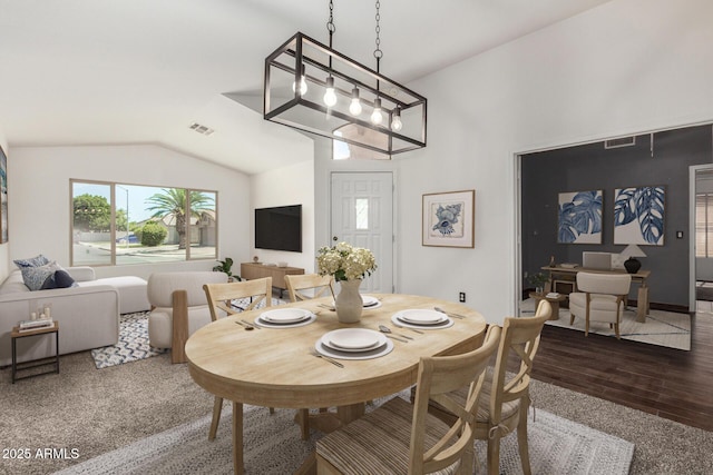 6502 W Wahalla Ln, Glendale, AZ 85308 - dining space with vaulted ceiling, wood finished floors, and carpet floors