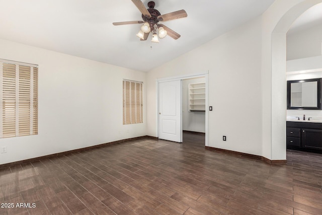 6502 W Wahalla Ln, Glendale, AZ 85308 - unfurnished bedroom with vaulted ceiling, arched walkways, dark wood-type flooring, a closet, and ensuite bath