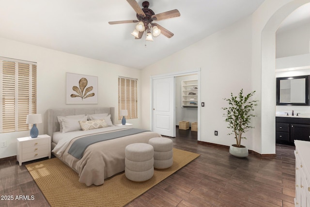 6502 W Wahalla Ln, Glendale, AZ 85308 - bedroom featuring arched walkways, dark wood finished floors, a closet, a ceiling fan, and high vaulted ceiling