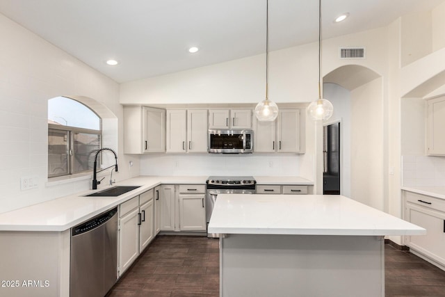 6502 W Wahalla Ln, Glendale, AZ 85308 - kitchen with stainless steel appliances, tasteful backsplash, dark wood finished floors, light countertops, and lofted ceiling