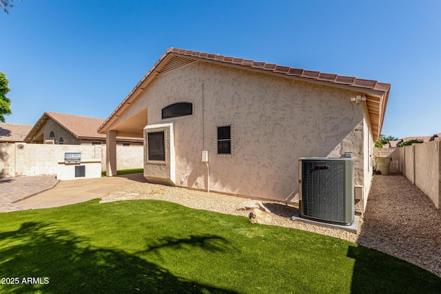 6502 W Wahalla Ln, Glendale, AZ 85308 - back of house featuring stucco siding, a fenced backyard, and a patio