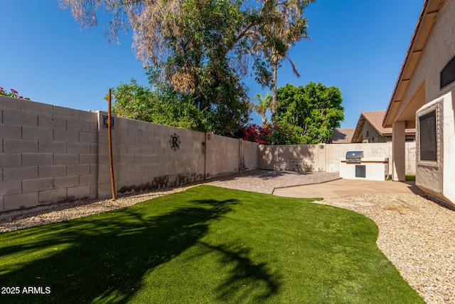 6502 W Wahalla Ln, Glendale, AZ 85308 - fenced backyard featuring area for grilling and a patio