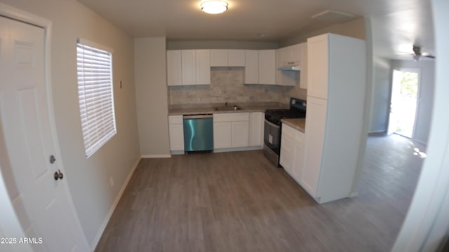 kitchen featuring white cabinetry, hardwood / wood-style floors, tasteful backsplash, and stainless steel appliances