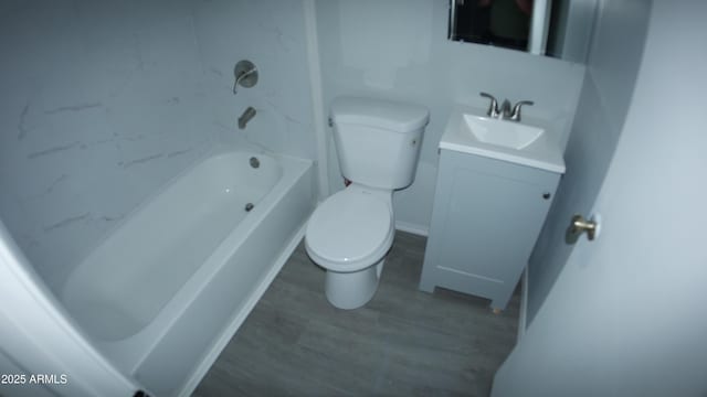 bathroom featuring vanity, wood-type flooring, and toilet