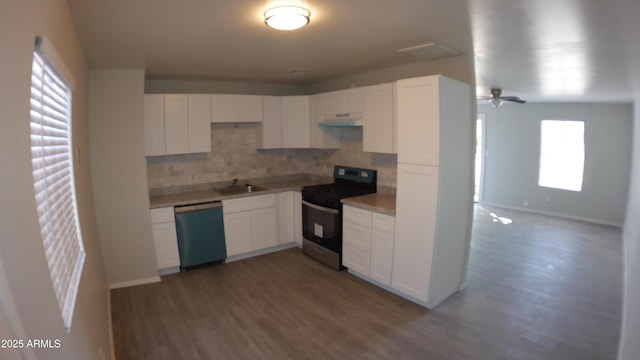 kitchen featuring tasteful backsplash, appliances with stainless steel finishes, sink, and white cabinets