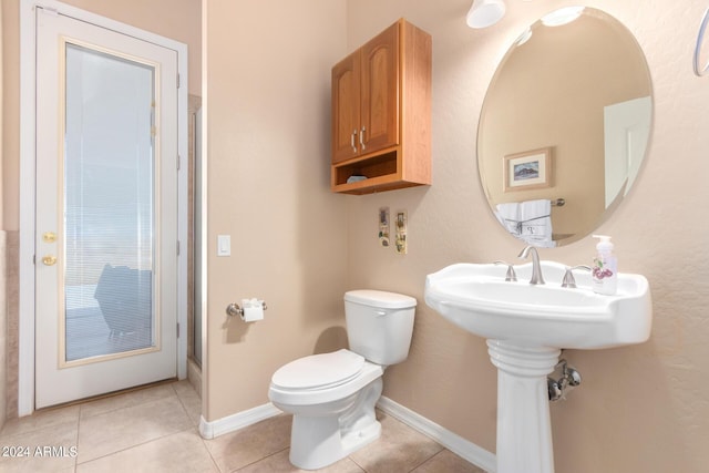 bathroom with tile patterned floors and toilet