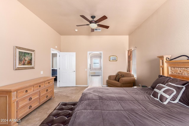 tiled bedroom featuring ceiling fan