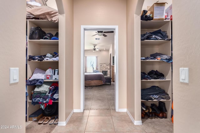 walk in closet featuring light tile patterned floors