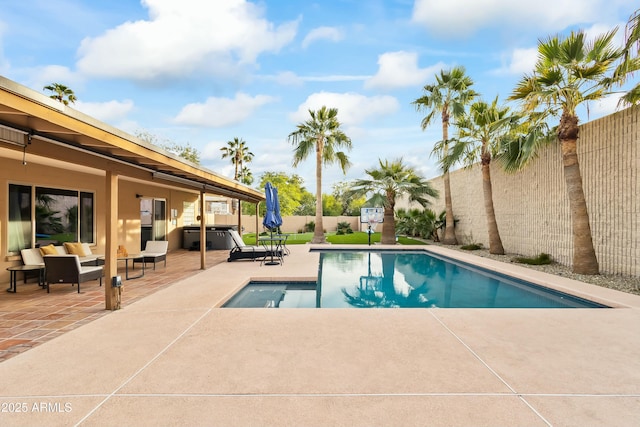 view of swimming pool featuring an outdoor living space and a patio