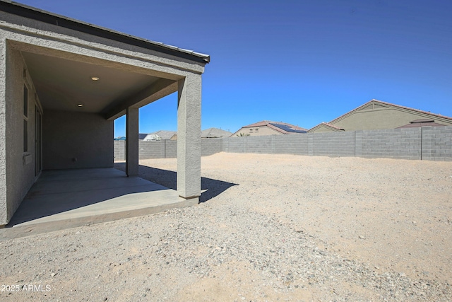 view of yard featuring a fenced backyard and a patio