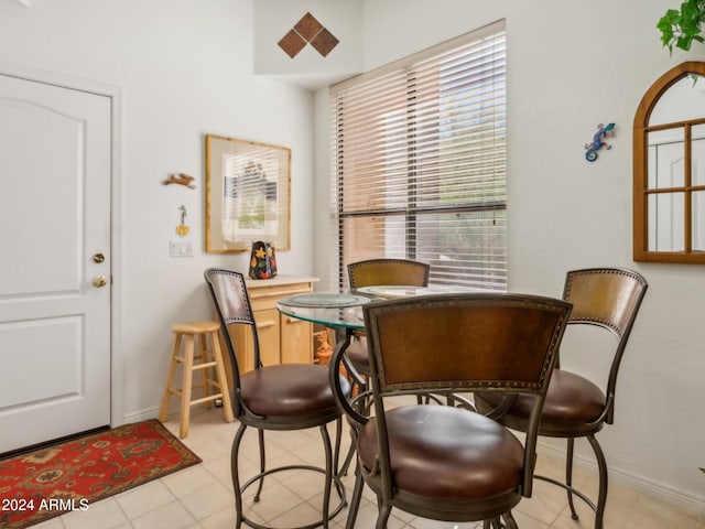 dining area featuring light tile patterned floors