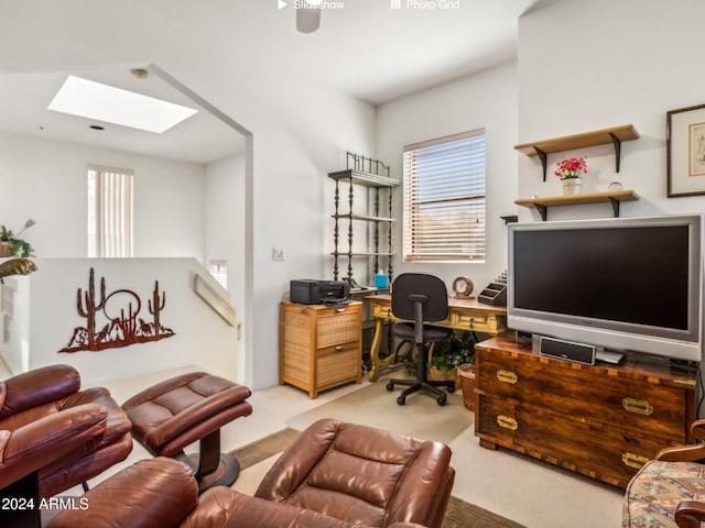 carpeted home office featuring a skylight and a wealth of natural light