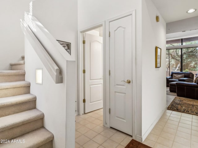 staircase with tile patterned flooring