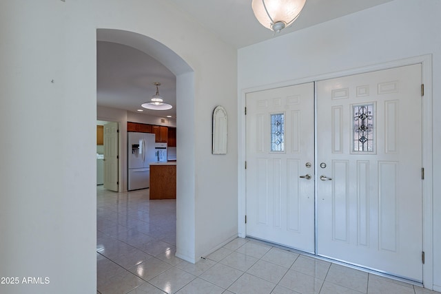 entrance foyer with light tile patterned flooring