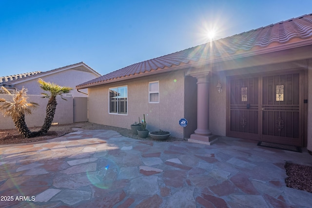 back of property featuring a patio area