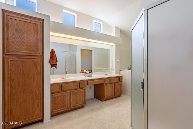 bathroom with a shower with door, vaulted ceiling, and vanity