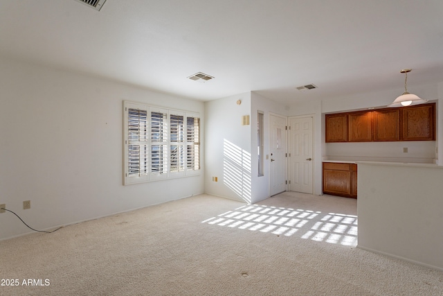 unfurnished living room with light carpet