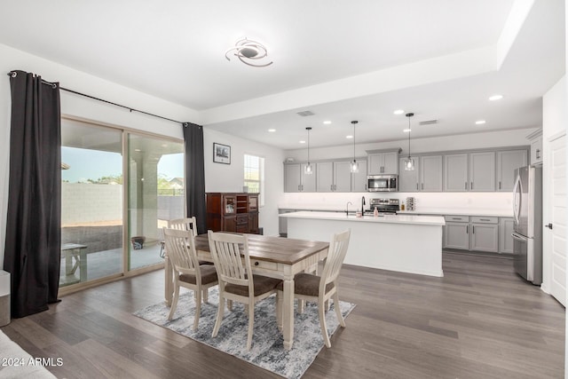 dining room with dark hardwood / wood-style flooring