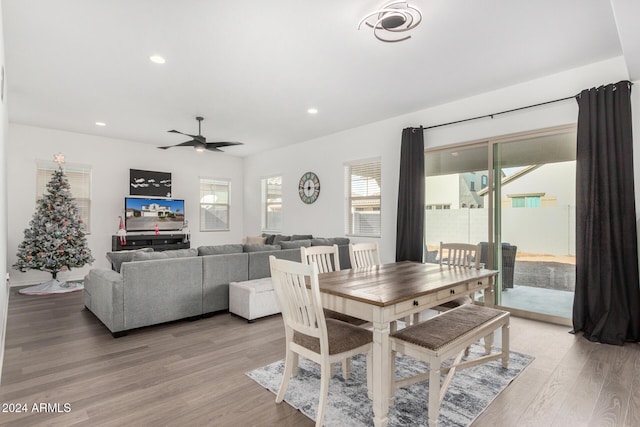 dining space featuring ceiling fan and light hardwood / wood-style floors