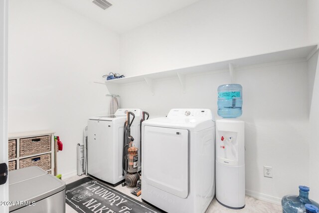 laundry room with independent washer and dryer