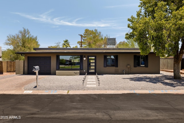7620 N 12th Pl, Phoenix, AZ 85020 - view of front of property with driveway and a garage