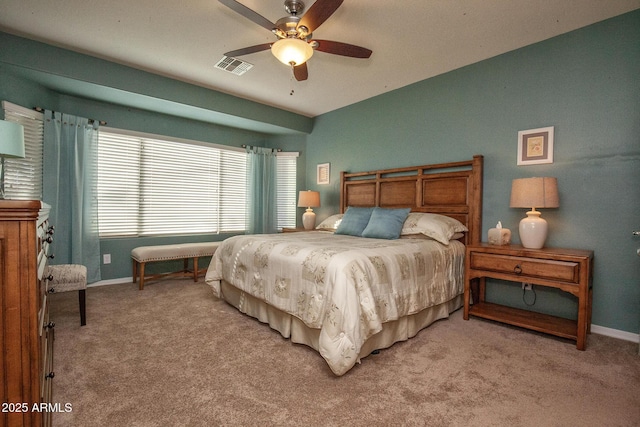 bedroom featuring light colored carpet and ceiling fan