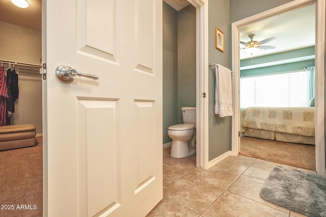 bathroom featuring tile patterned floors, ceiling fan, and toilet