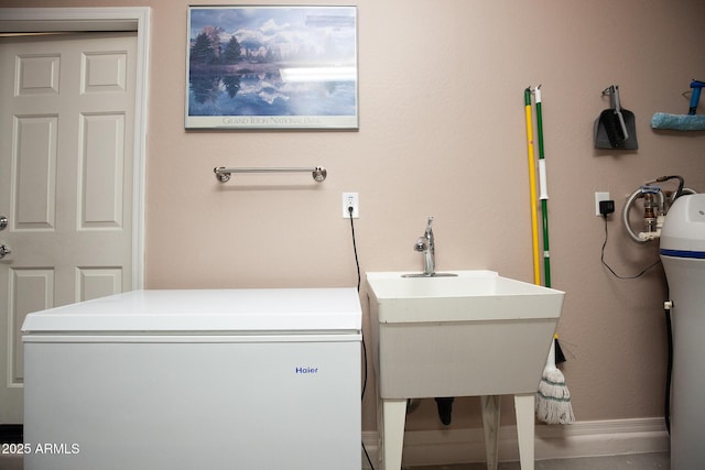 laundry area with sink