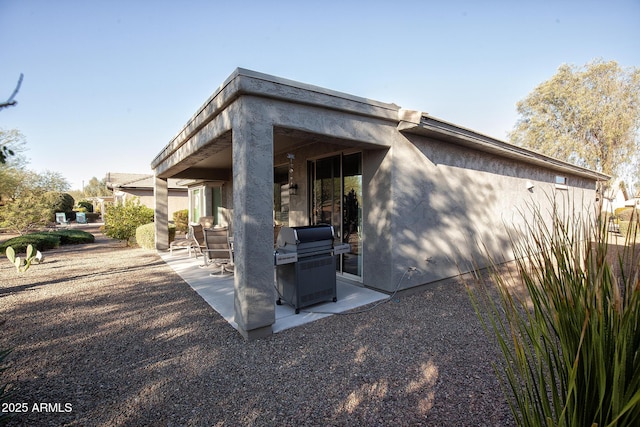 view of home's exterior with a patio