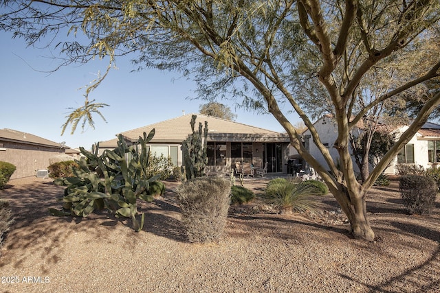 rear view of property with a patio area