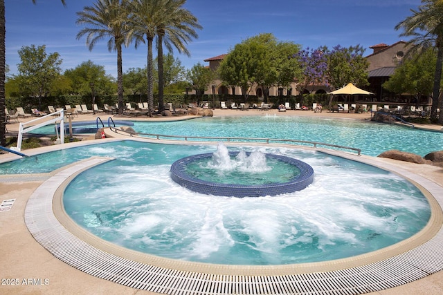 view of swimming pool featuring pool water feature