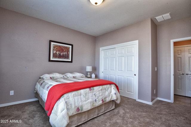 bedroom featuring dark carpet and a closet