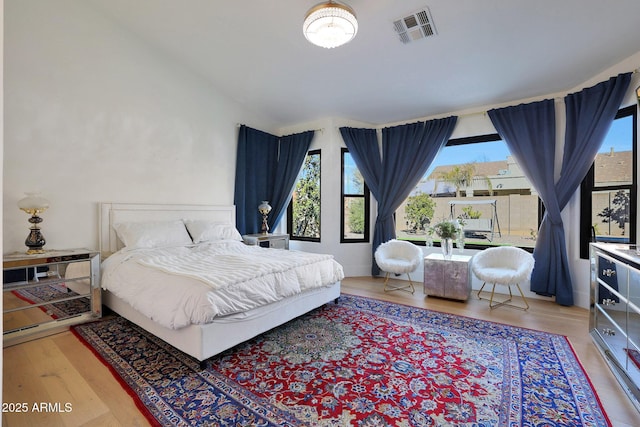 bedroom with hardwood / wood-style flooring