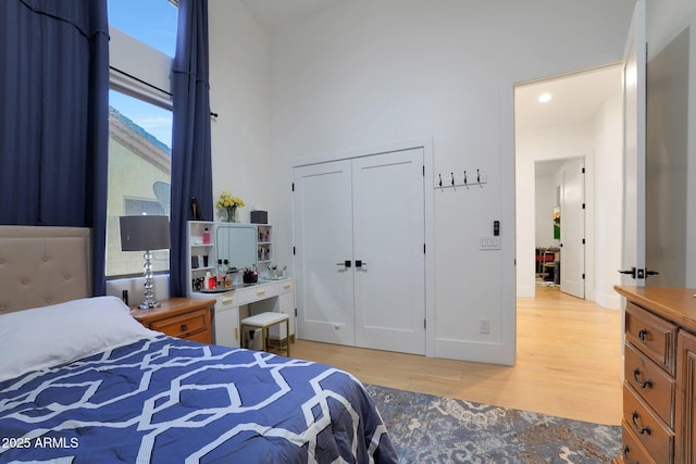 bedroom featuring a closet and light wood-type flooring