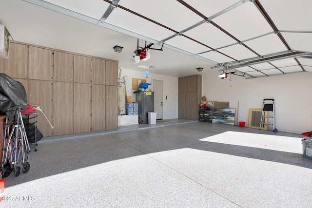 garage with a garage door opener and water heater