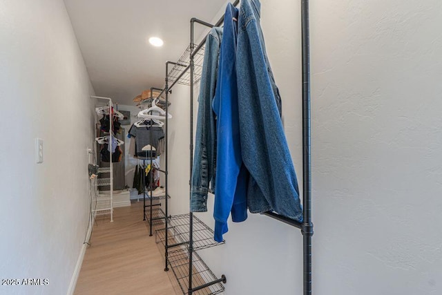 spacious closet with wood finished floors