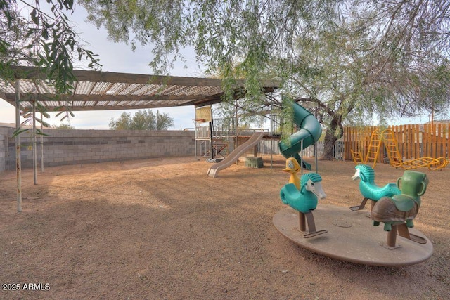 view of yard featuring a playground and fence