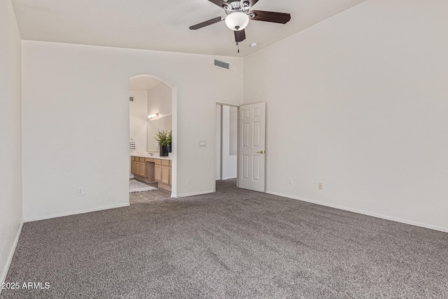 10318 E Plata Ave, Mesa, AZ 85212 - unfurnished room featuring a ceiling fan, carpet flooring, arched walkways, and lofted ceiling