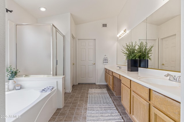 10318 E Plata Ave, Mesa, AZ 85212 - bathroom featuring double vanity, a shower stall, a garden tub, and vaulted ceiling