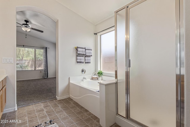 10318 E Plata Ave, Mesa, AZ 85212 - bathroom with vaulted ceiling, a shower stall, ceiling fan, a bath, and vanity