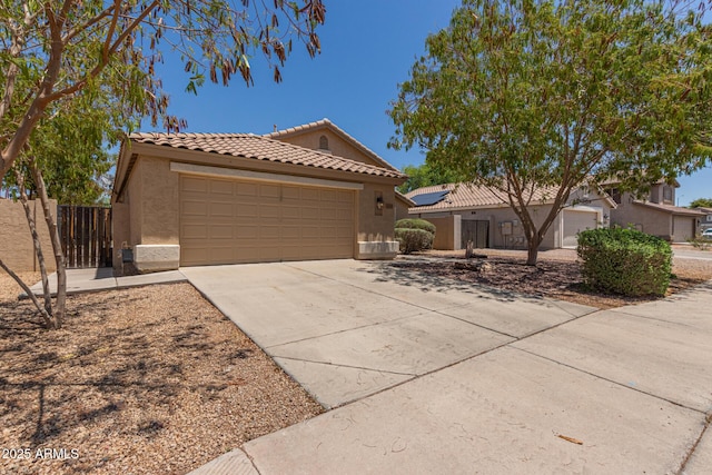 10318 E Plata Ave, Mesa, AZ 85212 - view of front of property with a tiled roof, stucco siding, an attached garage, and concrete driveway