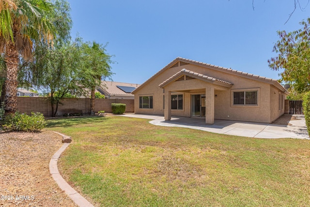 10318 E Plata Ave, Mesa, AZ 85212 - rear view of house with stucco siding, a fenced backyard, a tiled roof, and a patio area