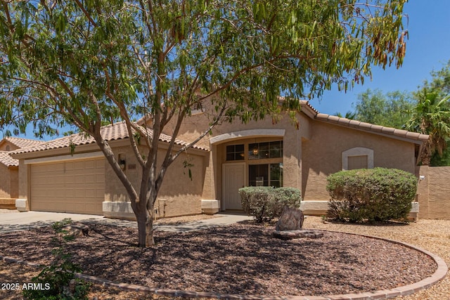 10318 E Plata Ave, Mesa, AZ 85212 - mediterranean / spanish house with stucco siding, a garage, a tiled roof, and concrete driveway